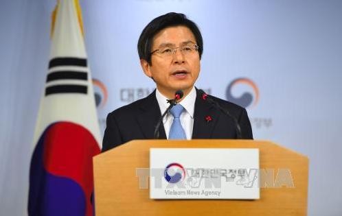 韓国大統領代行首相「北の核脅威に強力対応」＝仕事始め式 - ảnh 1