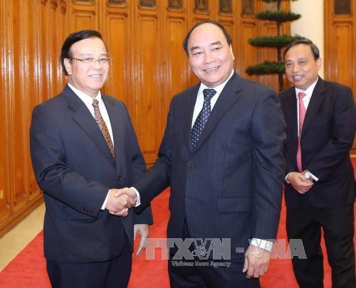 Deputi PM Nguyen Xuan Phuc menerima delegasi Kementerian Perencanaan dan Investasi Laos - ảnh 1