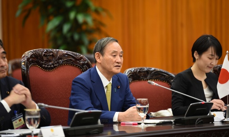 Official welcome ceremony for Japanese PM in Hanoi - ảnh 12