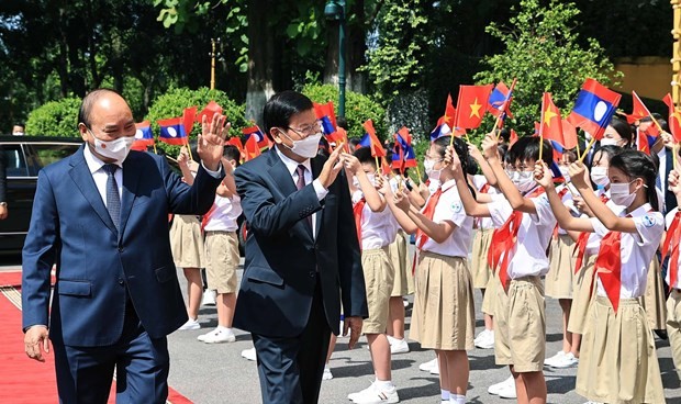 Top Lao leader’s visit to Vietnam grabs Lao headlines - ảnh 1