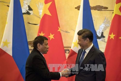 Presidente filipino reunido en Beijing con su par chino en visita de Estado   - ảnh 1