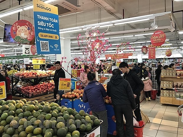 Reanudan actividades comerciales en Hanói en el segundo día feriado del Año Nuevo Lunar - ảnh 1