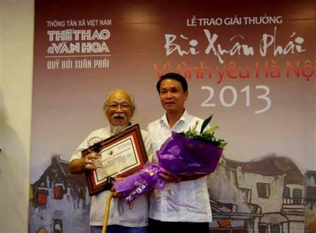 Veterano fotógrafo y su amor a Hanoi - ảnh 1