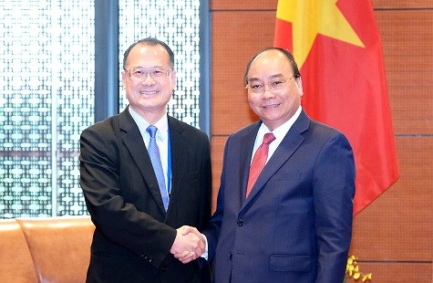 Le chef du gouvernement vietnamien reçoit le président du groupe Sunwah - ảnh 1